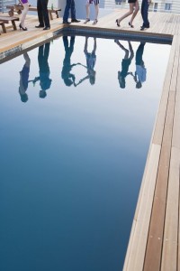Poolside party and reflection in pool